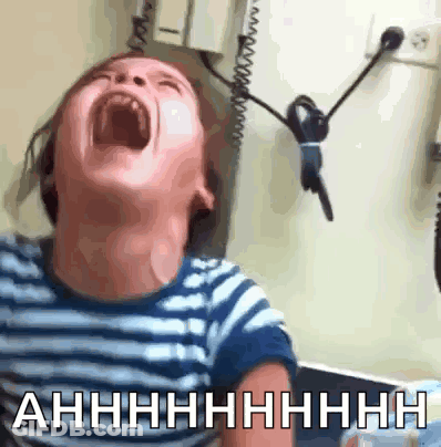 A Child Is Screaming With The Words Ahhhh Written On The Bottom Of The Image GIF