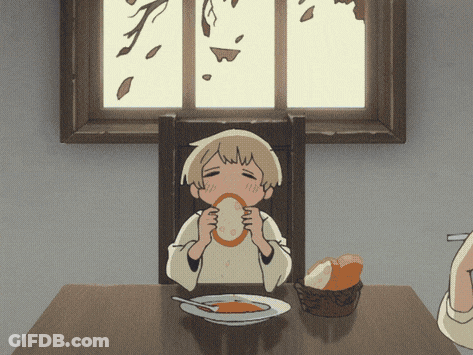 A Child Is Sitting At A Table With A Plate Of Food And A Basket Of Bread GIF