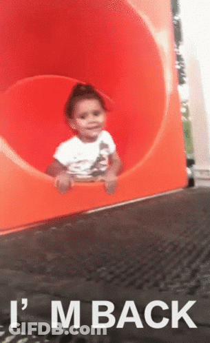 A Child On A Slide With The Words " I 'M Back " On The Bottom GIF