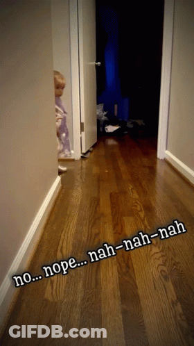 A Child Standing In A Hallway With The Words Nope Nah-Nah-Nah Written On The Floor GIF