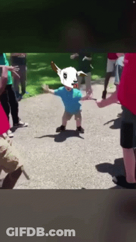Child Wearing Goat Hat Dancing In Circle GIF
