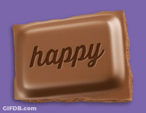 A Chocolate Bar That Has The Word Happy Written On It GIF