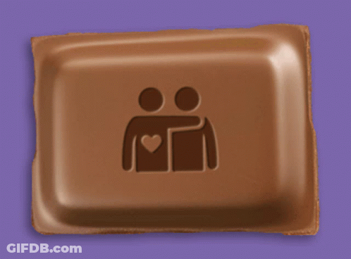 A Chocolate Bar With Two People Hugging Each Other And A Heart On It GIF