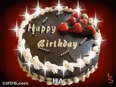 A Chocolate Birthday Cake With Strawberries On Top Of It . GIF