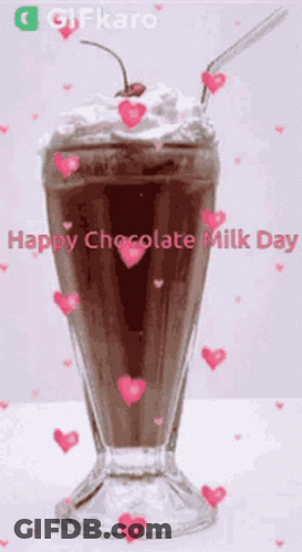 A Chocolate Milkshake With Whipped Cream And A Cherry In It GIF