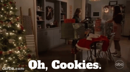 A Christmas Scene With A Box That Says Oh Cookies On It GIF