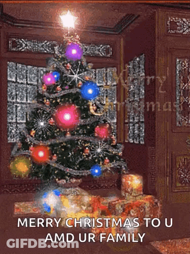 A Christmas Tree In A Living Room With The Words Merry Christmas To U And Ur Family GIF