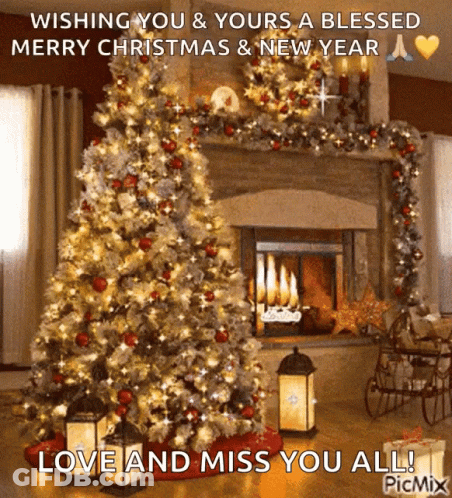 A Christmas Tree In Front Of A Fireplace With The Words Wishing You & Yours A Blessed Merry Christmas And New Year GIF