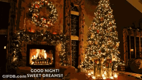 A Christmas Tree Is Lit Up In A Living Room GIF