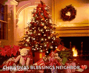 A Christmas Tree Is Sitting In Front Of A Fireplace Surrounded By Presents And A Teddy Bear . GIF