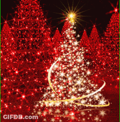 A Christmas Tree Surrounded By Red Trees With A Star On Top GIF