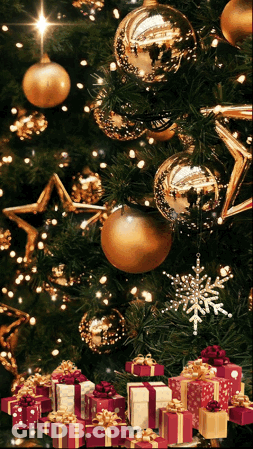 A Christmas Tree With Gifts Underneath It And Gold Ornaments GIF