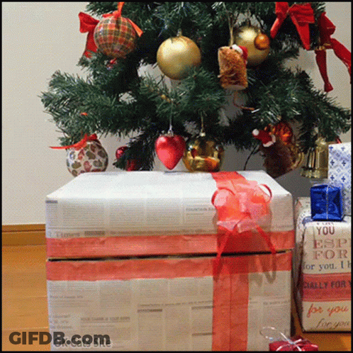 A Christmas Tree With Presents Under It And A Box That Says You Esp For You GIF