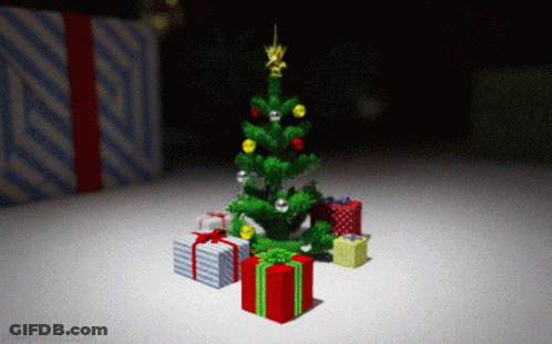 A Christmas Tree With Presents Underneath It And A Sheepfilms.co.uk Logo GIF