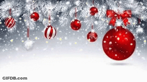 A Christmas Tree With Red And White Christmas Decorations Hanging From It . GIF