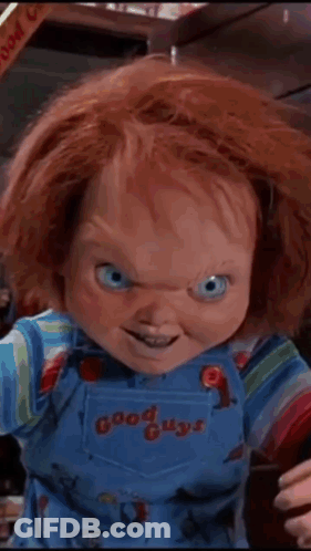 A Chucky Doll From The Movie Good Guys Is Smiling For The Camera GIF