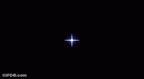 A Circle Of Fire With A Light Coming Out Of It On A Dark Background . GIF