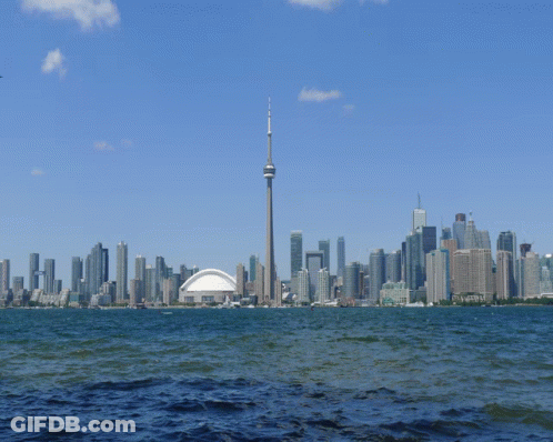 A City Skyline With The Cn Tower In The Middle GIF