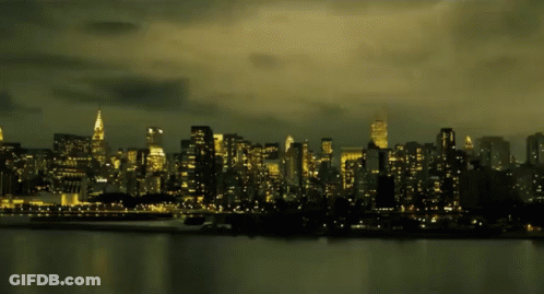 A City Skyline With The Empire State Building In The Distance GIF