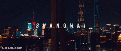 A City Skyline With The Word Shanghai In White Letters GIF