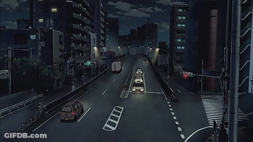 A City Street At Night With Cars Driving Down It And A Sign That Says ' Tokyo ' On It GIF