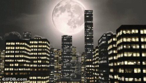 A Cityscape With A Full Moon In The Sky GIF