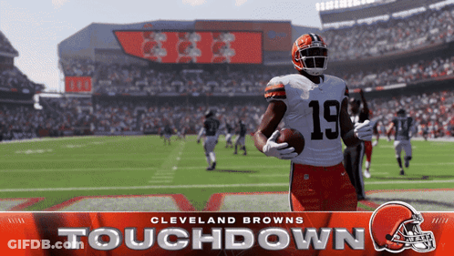 A Cleveland Browns Football Player Is Holding A Football GIF