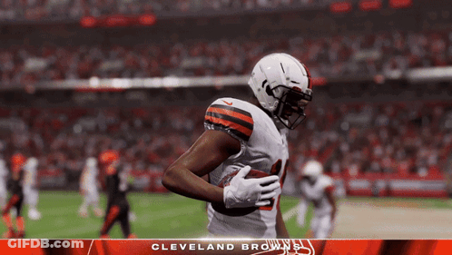 A Cleveland Browns Player Is Running With The Ball GIF