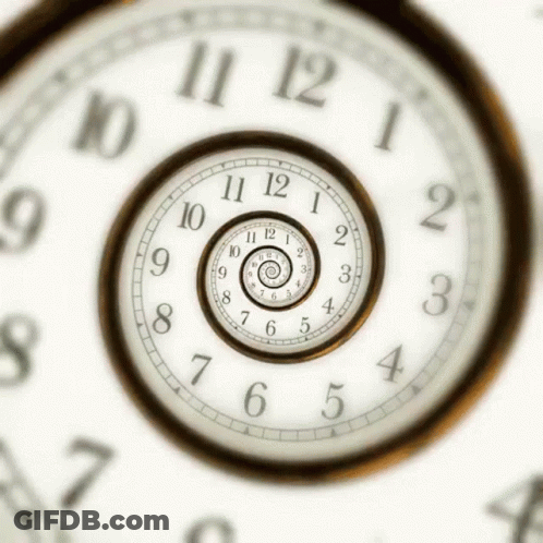 A Clock That Has The Hands On The Numbers 10 And 12 GIF