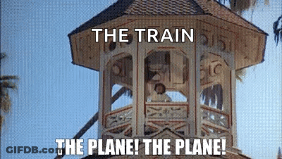 A Clock Tower With The Words `` The Train The Plane ! The Plane ! '' Written On It . GIF