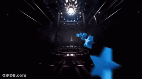 A Clock With A Red Cape And A Blue Ball On Top Of It GIF