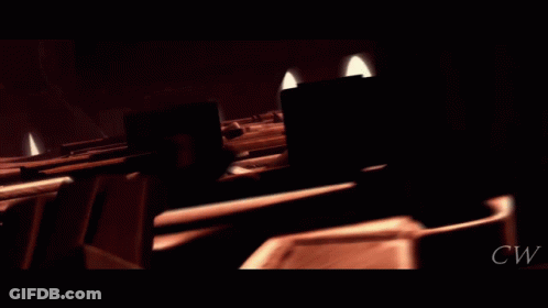 A Clone Trooper Is Standing In A Dark Room With A Gun GIF