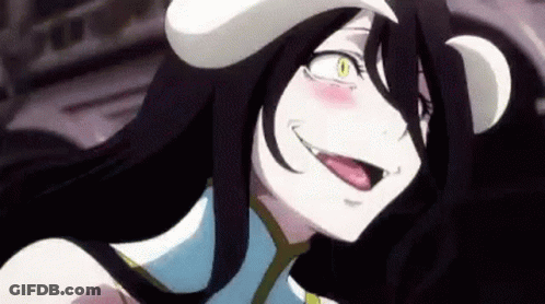 A Close Up Of A Anime Character With Her Tongue Out And A Hat On Her Head . GIF
