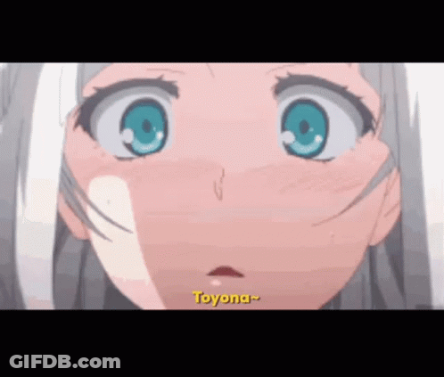 A Close Up Of A Anime Girl 'S Face With Blue Eyes And The Word Toyona Written In Yellow . GIF