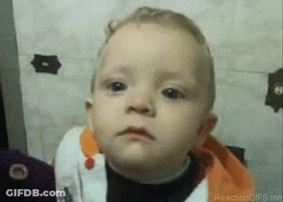 A Close Up Of A Baby Making A Funny Face . GIF