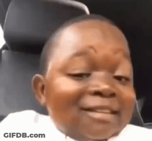 A Close Up Of A Baby Making A Funny Face In A Car . GIF