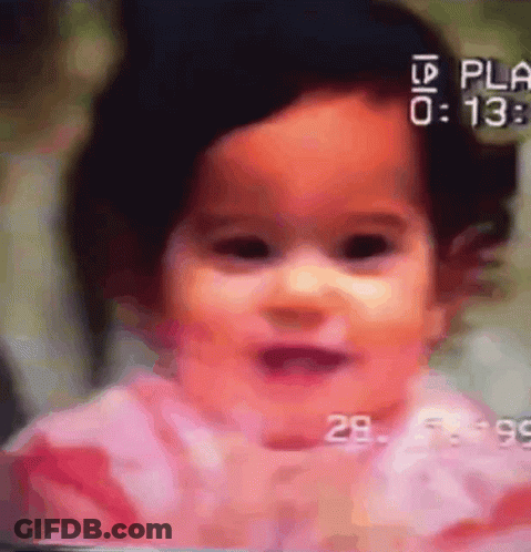 A Close Up Of A Baby 'S Face With The Numbers 0 And 13 On The Bottom Right GIF
