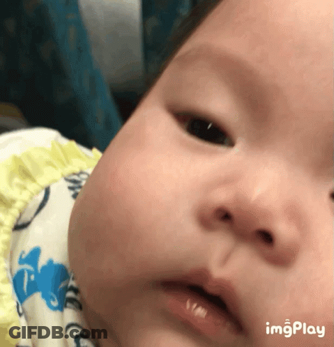A Close Up Of A Baby 'S Face With The Words Imgplay Below GIF