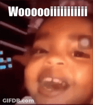 A Close Up Of A Baby 'S Face With The Words " Woooo " Written Above It GIF