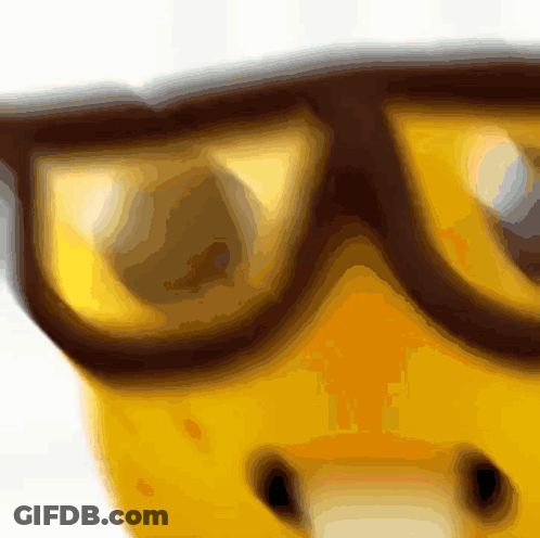 A Close Up Of A Banana Wearing Glasses On A White Background GIF