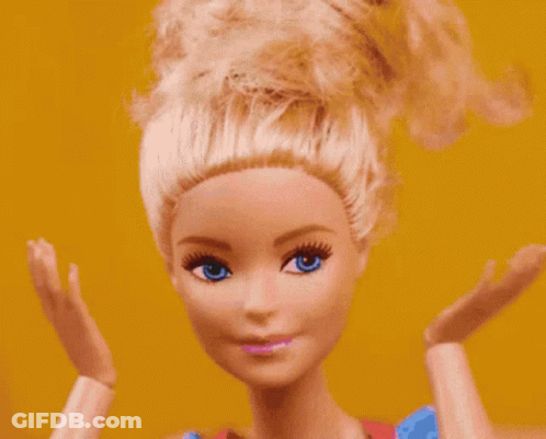 A Close Up Of A Barbie Doll 'S Face With Blue Eyes GIF