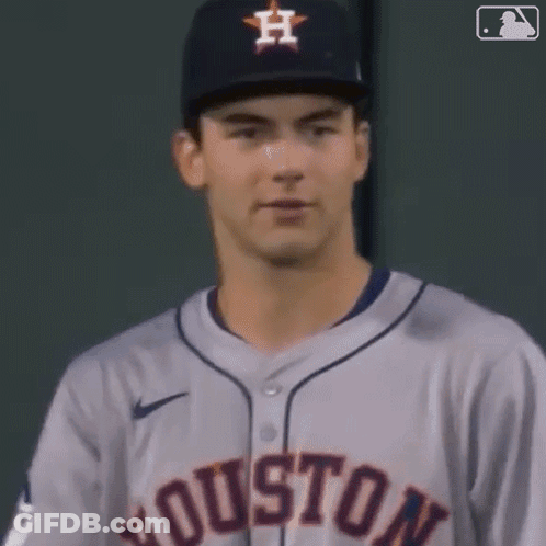 A Close Up Of A Baseball Player Wearing A Houston Jersey And Hat GIF