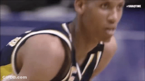 A Close Up Of A Basketball Player Kneeling On The Court . GIF