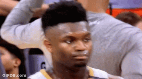 A Close Up Of A Basketball Player Looking At The Camera . GIF