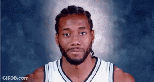 A Close Up Of A Basketball Player 'S Face Against A Blue Background . GIF