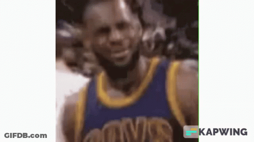 A Close Up Of A Basketball Player Wearing A Blue And Gold Uniform . GIF