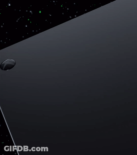 A Close Up Of A Black Box With A Green Circle In The Background GIF