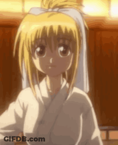 A Close Up Of A Blonde Anime Girl Wearing A White Robe And A White Towel On Her Head . GIF