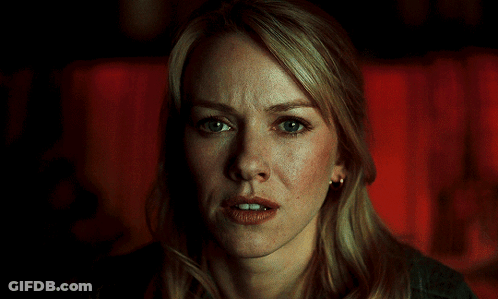 A Close Up Of A Blonde Woman 'S Face With A Red Background GIF