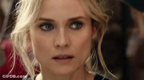 A Close Up Of A Blonde Woman 'S Face With Blue Eyes GIF